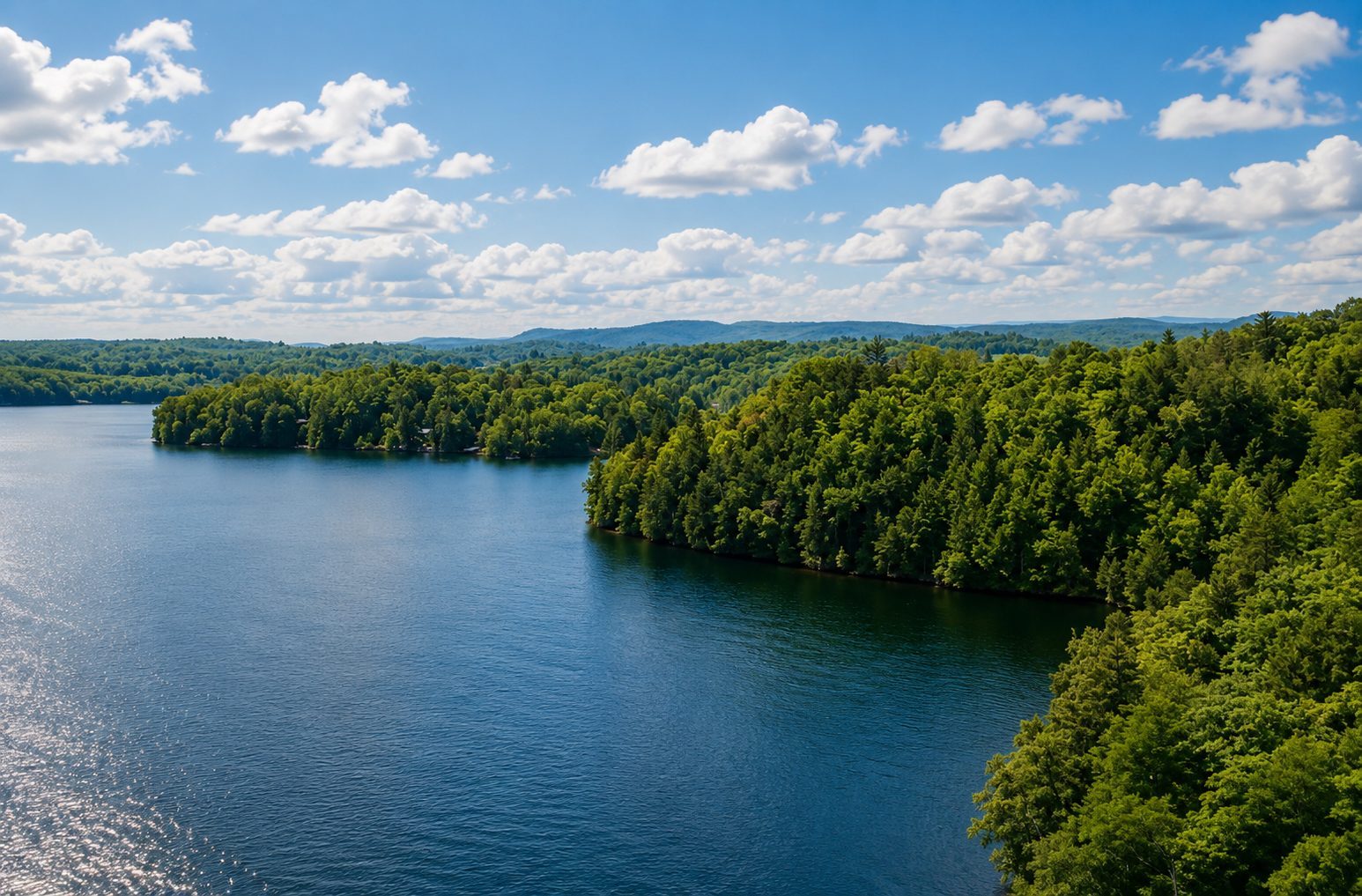 Elevated view of the waterfront estate and Outaouais hills
